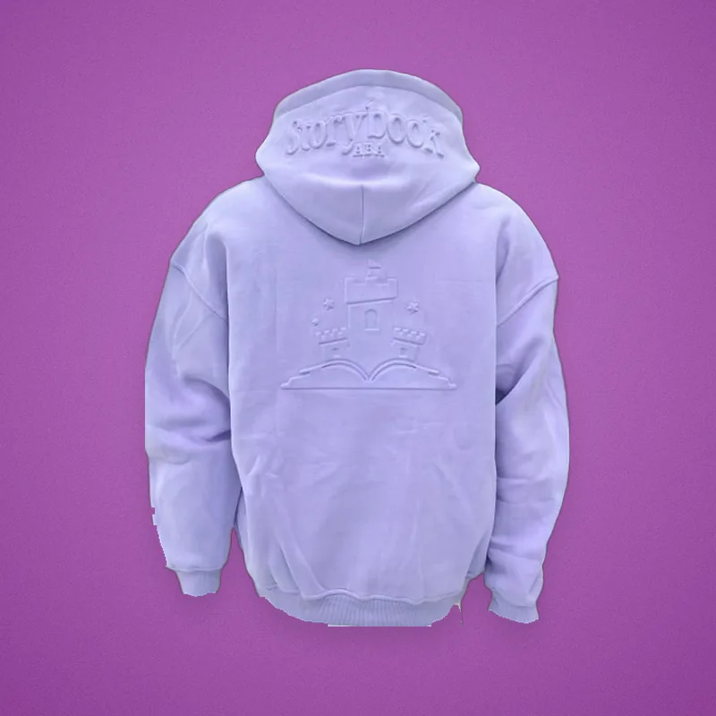 Back of a lavender hoodie with an embossed castle-and-book logo
